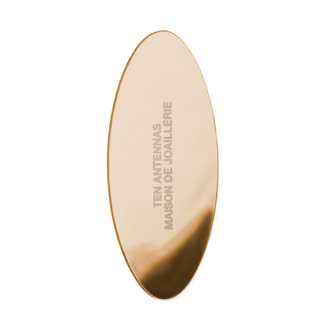 Le Miroir Ovale Gold Earring — oval mirror earring in gold-plated silver, worn on ear