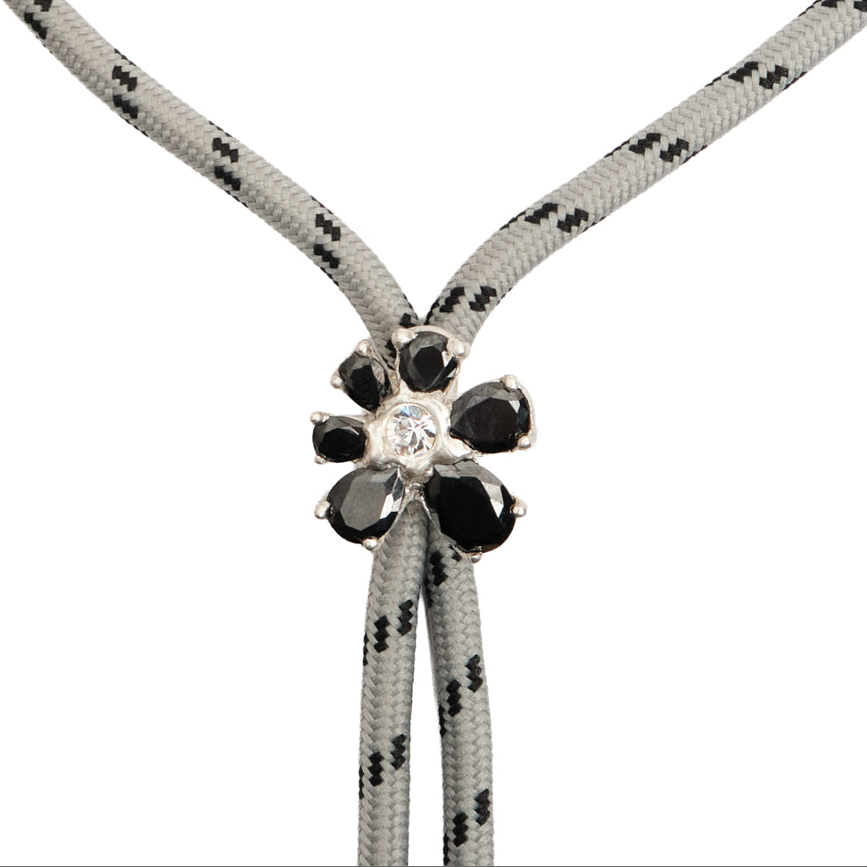 Fleur Brut Bolo Tie — Silver, floral bolo tie on a double cord