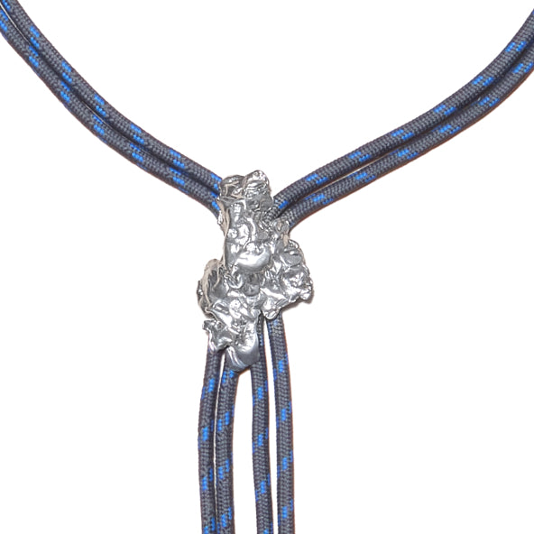 Le Geste Bolo Tie — Silver, sculptural bolo tie on a double cord