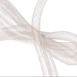 Bow Lumière Earring — Silver, bow formed from ultra-thin chain, worn on ear